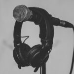 Best collaborative music production apps with headphones on a microphone