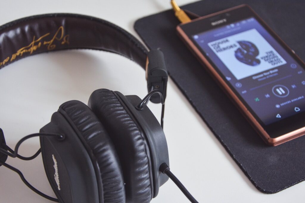 Headphones and mobile phone streaming music for Music Streaming Platform Trends - How They Impact Artists article
