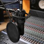 Mic and Mixing Board for Understanding Audio Production To Enhance Your Music Article