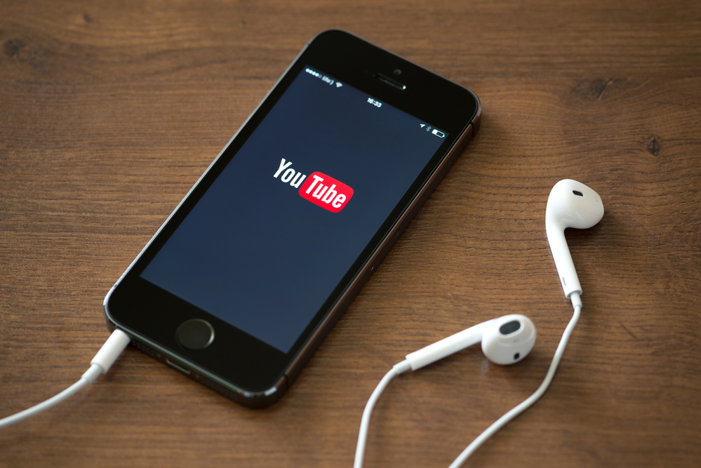 Mobile phone with YouTube logo for YouTube music pay per stream article