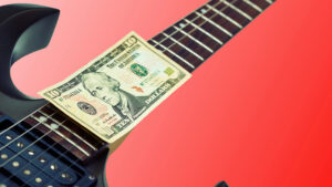 Electric guitar neck with 100 dollar bill