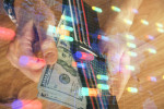 Double exposure of technology drawing hologram and us dollars bills and man hands. Data concept