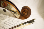 Sheet music and cello for musician's mechanical royalties